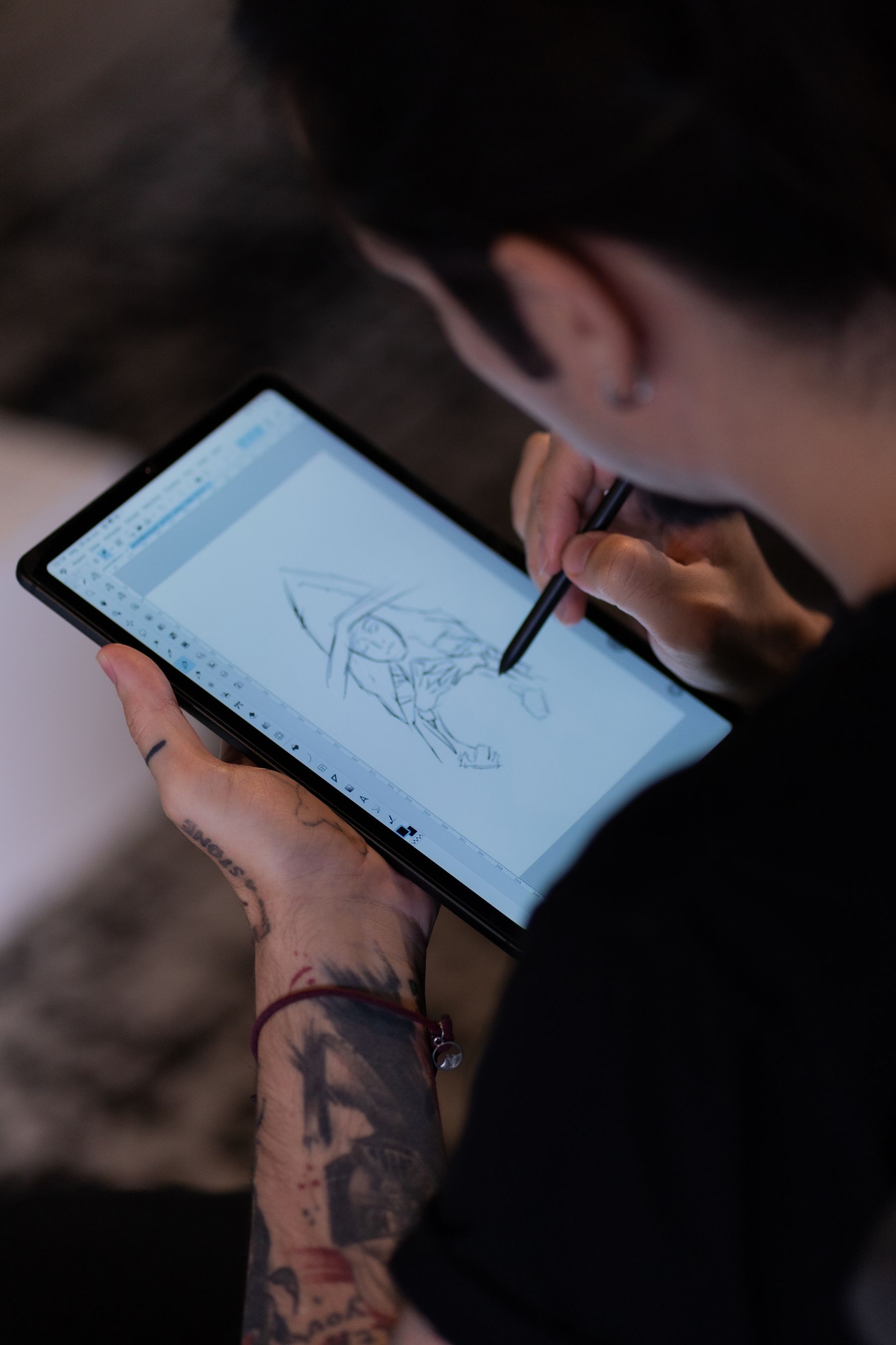 Artist developing digital artwork with a stylus