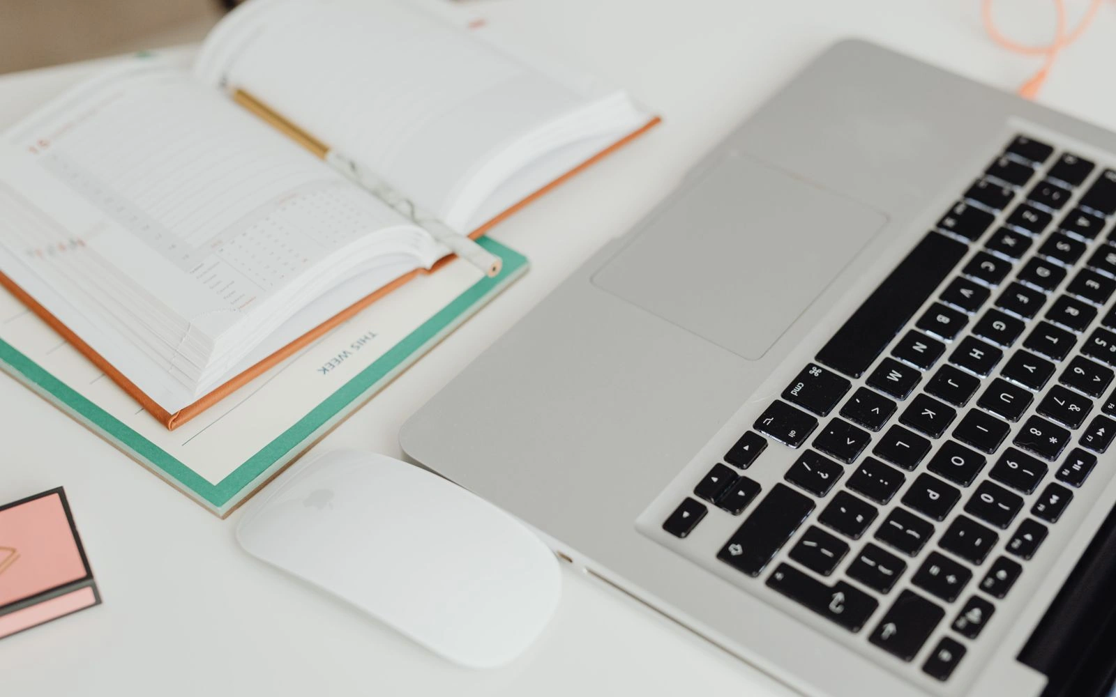 Editorial calendar and laptop arranged on a desk